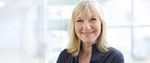 Die blonde Steuerring-Beraterin Christiane Legin lächelt in die Kamera